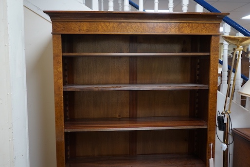 An Edwardian design bird's eye maple open bookcase, length 127cm, depth 32cm, height 193cm